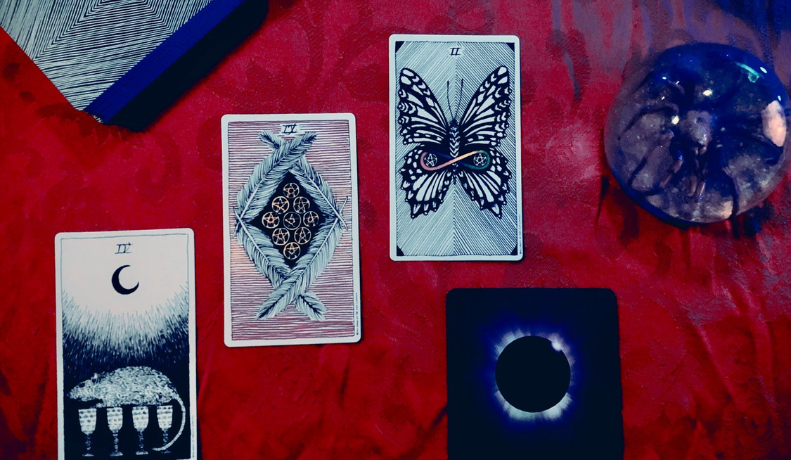 A spread of tarot and oracle cards
